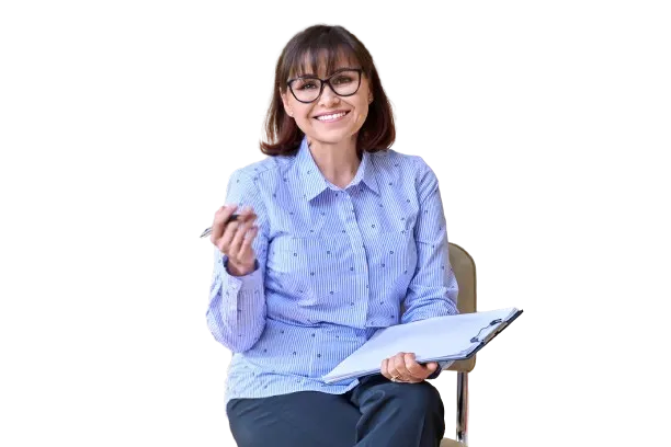 a teacher sitting in a chair with lesson plan